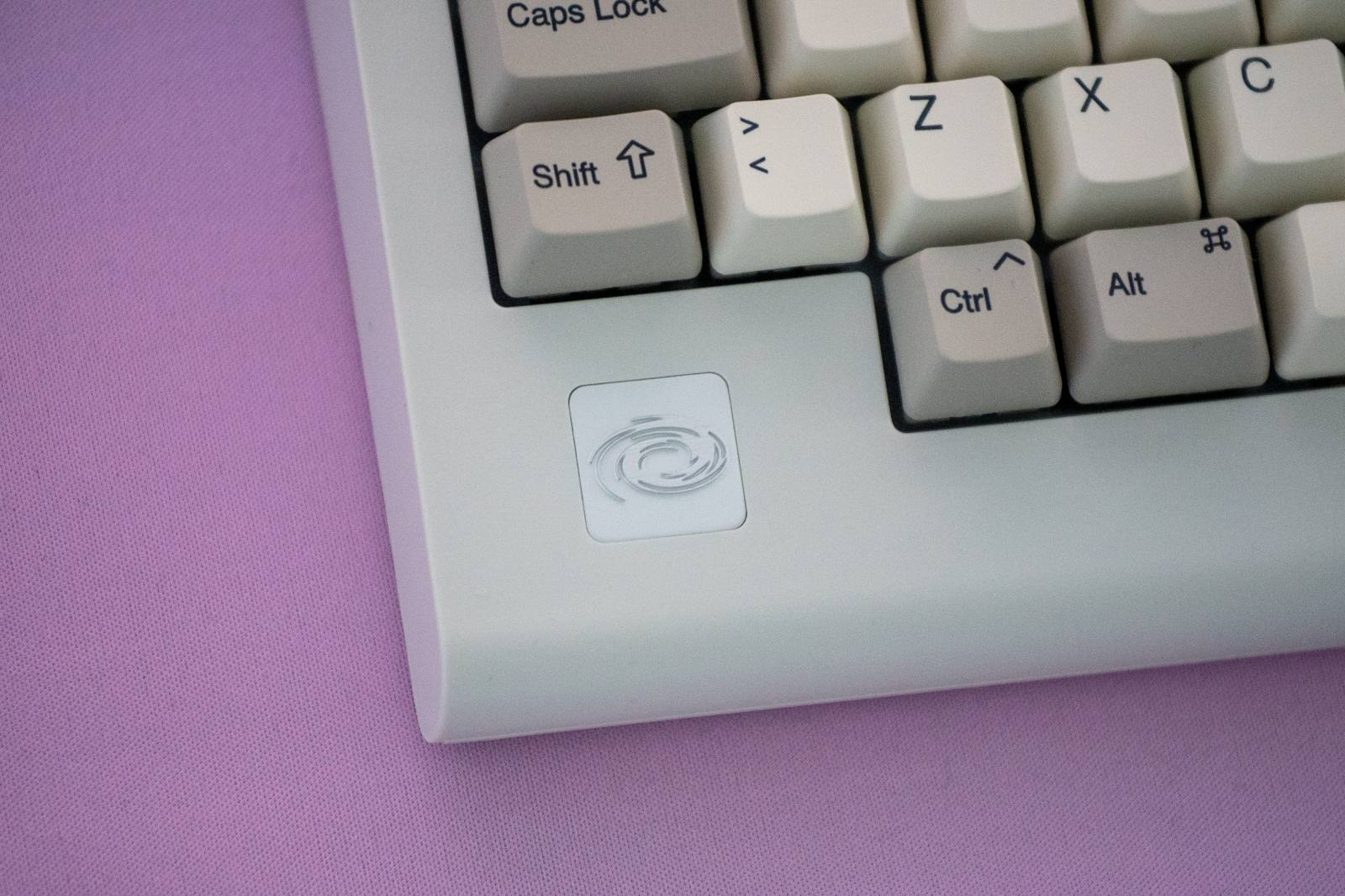 Zoomed in image on a logo-badge on the Vortex PC66 keyboard