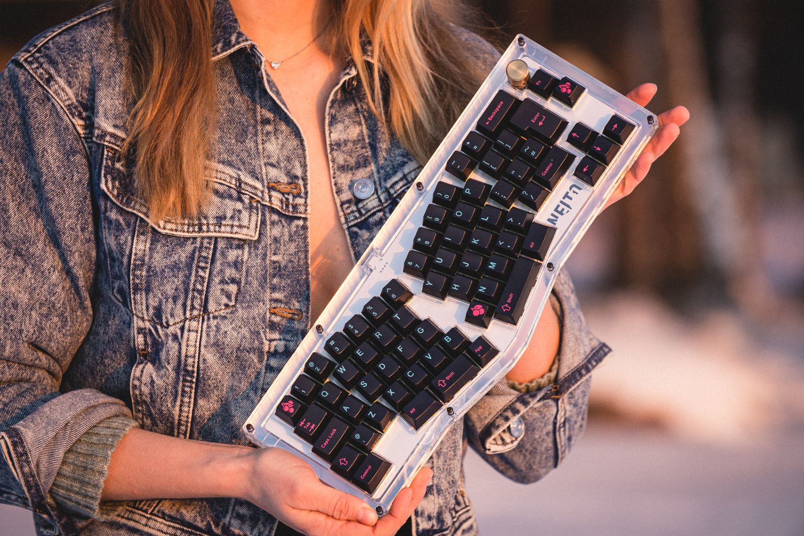 A female holding the Neito keyboard