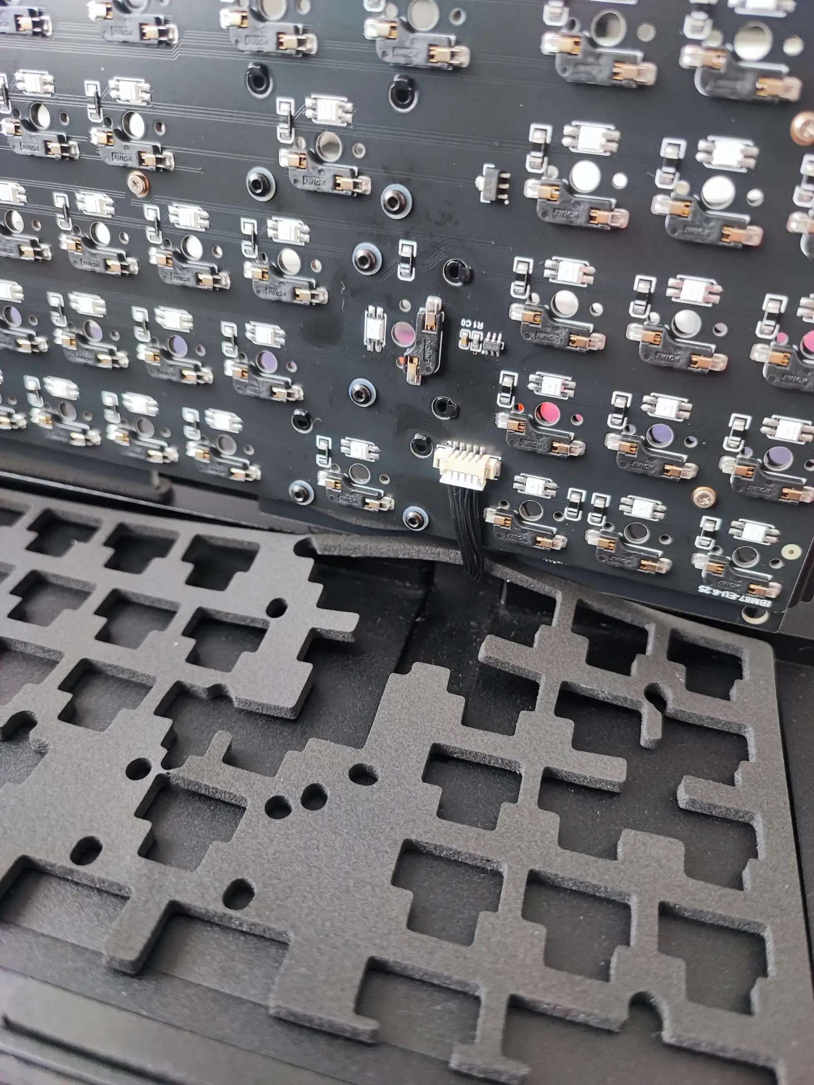 Installation of the PCB on top bottom foams, with the daughterboard connected