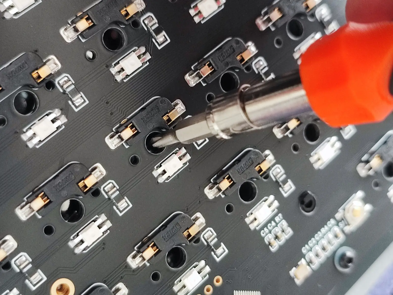 Aligning the middle-layer foam mat with a thin screwdriver