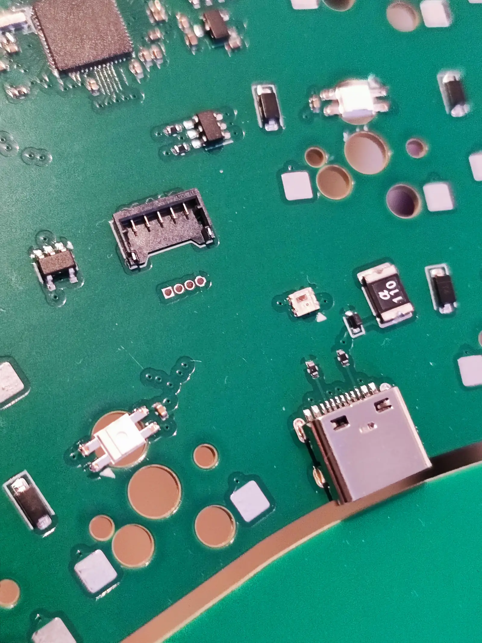 Closeup photo of the connectors as well as hidden traces of a prototype PCB
